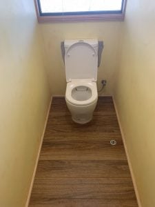 New toilet on floor boards